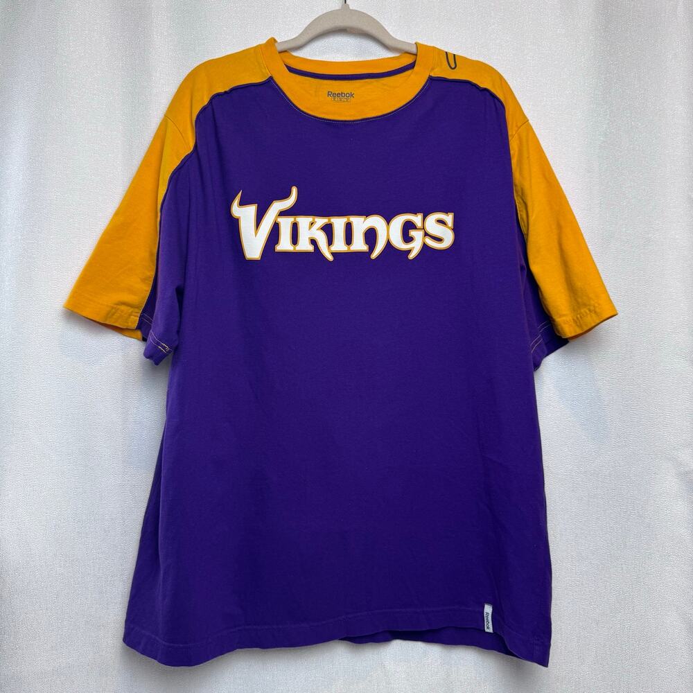 The Minnesota Vikings NFL Team Shirt  purple and yellow shoulder accents Size XL